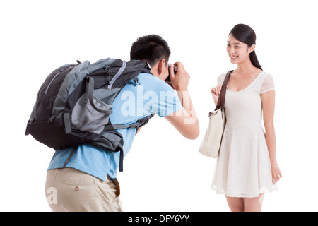 Man taking pictures of smiling wife Stock Photo