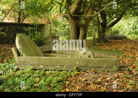 An old and overgrown graveyard. Stock Photo