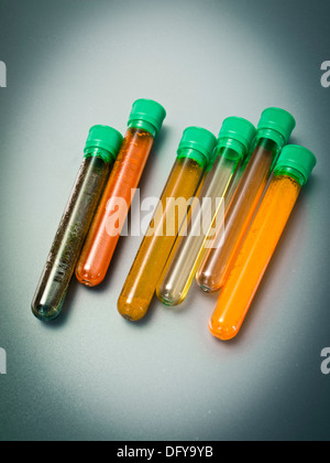 Test-tubes on color background Stock Photo - Alamy