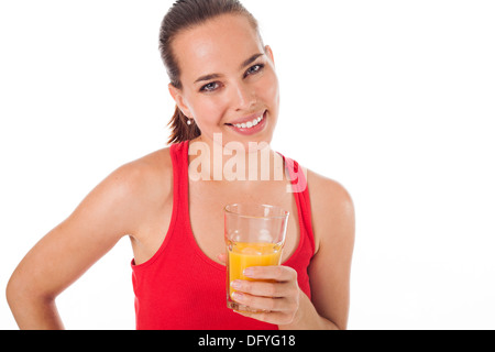 Portrait of a woman drinking an orange juice and smiling, isolated on white Stock Photo