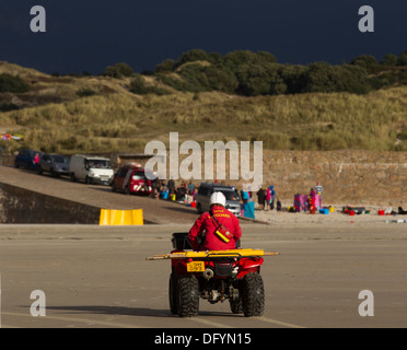 RNLI  Lifeguards on St Ouen's beach Jersey & Quad Bike Channel Islands Stock Photo