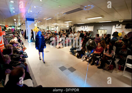 Manchester, UK. 10th Oct, 2013. A young woman takes part in a catwalk event in the BHS store in Manchester city centre, as part of the 2013 Vogue Fashion's Night Out. Over 150 retailers held shopping events, outdoor markets and music in the city centre. Credit:  Russell Hart/Alamy Live News. Stock Photo