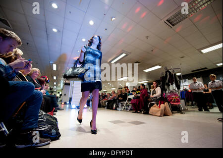 Manchester, UK. 10th Oct, 2013. A young woman takes part in a catwalk event in the BHS store in Manchester city centre, as part of the 2013 Vogue Fashion's Night Out. Over 150 retailers held shopping events, outdoor markets and music in the city centre. Credit:  Russell Hart/Alamy Live News. Stock Photo