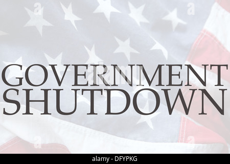 the words government shutdown on an old USA flag Stock Photo