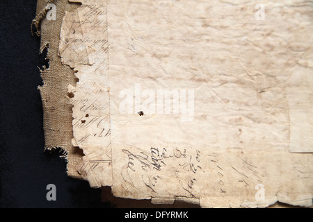 highly textured old papers from the late 18th century with burlap on black Stock Photo