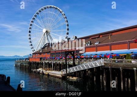 Pier 57 restaurants and Seattle Great Wheel. Seattle, Washington, USA. Stock Photo