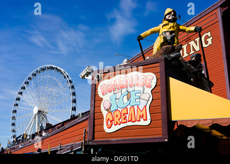 Seattle waterfront, Pier 57 with Miners Landing building and Ferris wheel. Seattle, Washington, USA. Stock Photo