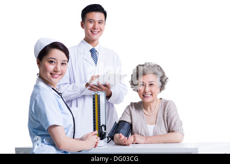 Nurse, doctor and patient Stock Photo