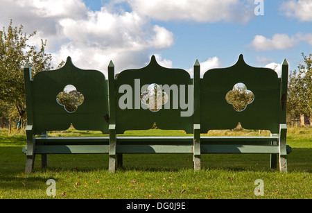 Three-seater in the orchard at Coughton Court, Alcester, Warwickshire, Great Britain. Stock Photo