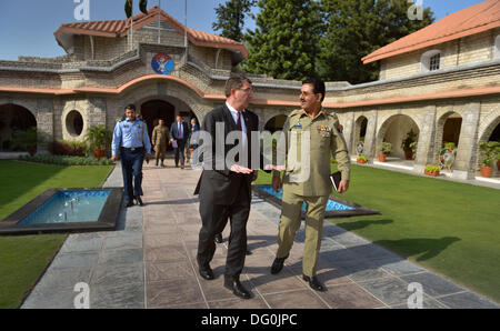 US Deputy Secretary of Defense Ashton B. Carter is escorted to his awaiting motorcade by Gen. Khalid Shameem, Chairman of the Joint Chiefs of Staff for Pakistan September 16, 2013 in Islamabad, Pakistan. Carter a theoretical physicist and former Harvard professor resigned from the Pentagon October 10, 2013. Stock Photo