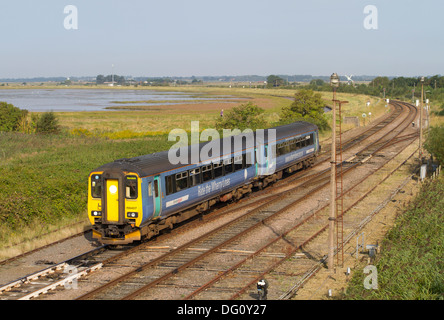 A class 156 diesel multiple unit working a Wherry Lines service approaching Great Yarmouth.