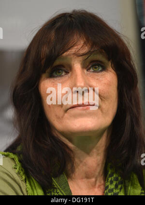 Frankfurt Main, Germany. 11th Oct, 2013. German author Christiane Felscherinow looks on during a discussion about addiction at the Frankfurt Book Fair in Frankfurt Main, Germany, 11 October 2013. The author is best-known for her contribution to the autobiographical book 'Wir Kinder vom Bahnhof Zoo' ('We Children of Bahnhof Zoo'), in which her teenage drug use is documented. Now the 51-year-old has released a second autobiography. Photo: ARNE DEDERT/dpa/Alamy Live News Stock Photo