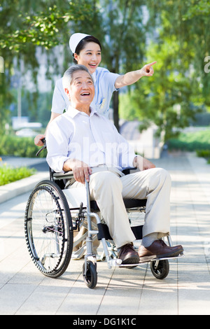 Nurse with wheelchair bound patient Stock Photo