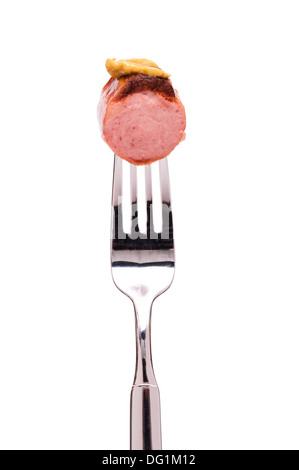 Smoked polish sausage with mustard on a fork Stock Photo
