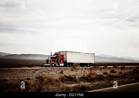 18-Wheel Truck on Desert Highway, Arizona, USA Stock Photo