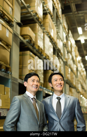 Happy businessmen in warehouse Stock Photo