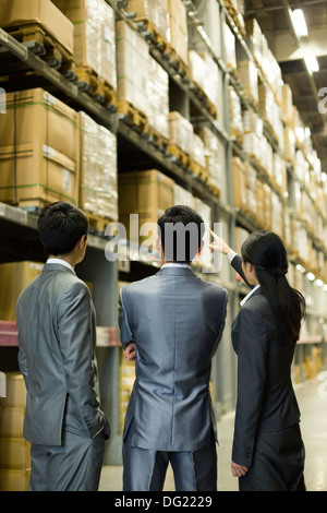 Business people talking in warehouse Stock Photo