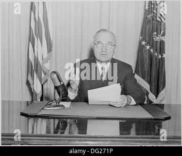 Photograph of President Truman delivering a radio speech to the nation on the status of his program for reconversion... 199289 Stock Photo