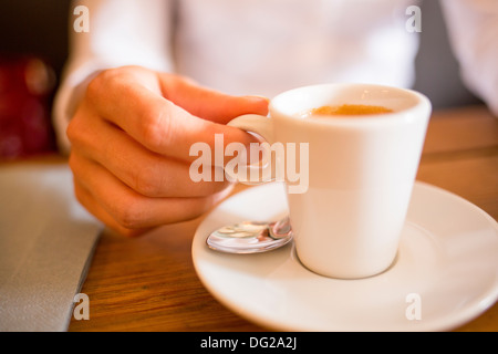 Female restaurant hand coffee table Stock Photo
