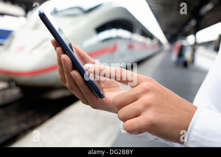 Female mobile phone tgv message sms Stock Photo