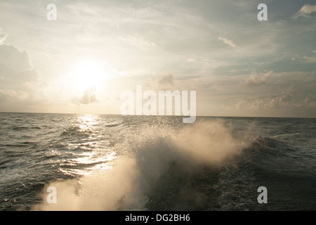 Waves from the Indian Ocean Sunset cruise Rainbow Meeru Island Resort Maldives Stock Photo