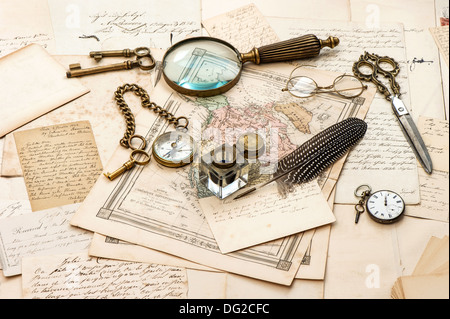 antique accessories, old letters and maps, vintage ink pen. nostalgic sentimental journey background Stock Photo