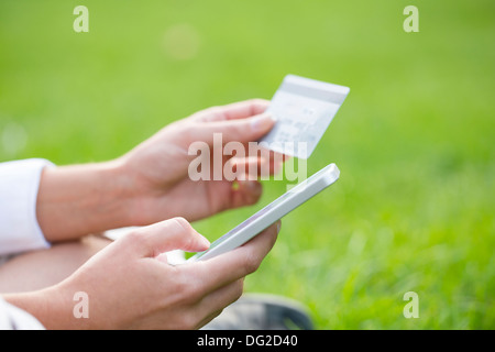 Female outdoor computer finger web plastic card Stock Photo