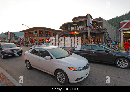 Tourists and traffic at an intersection of the main road, Parkway 441, in downtown Gatlinburg, Tennessee Stock Photo