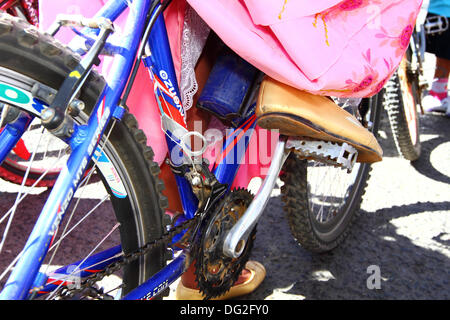 El Alto, Bolivia. 12th Oct, 2013.  Detail of a competitor's typical Cholita footwear and dress as she lines up before the start of a Cholitas Bicycle Race for indigenous Aymara women. The race is held at an altitude of just over 4,000m along main roads in the city of El Alto (above the capital, La Paz) for Bolivian Womens Day, which was yesterday Friday October 11th. Credit:  James Brunker / Alamy Live News Stock Photo