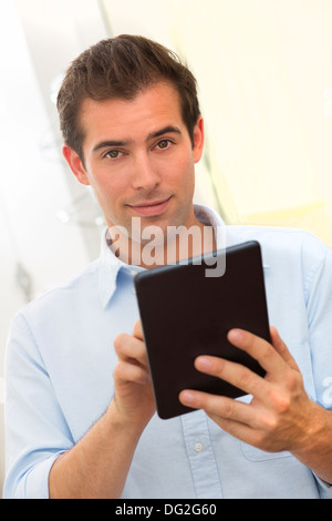 Male working on digital tablet at home Stock Photo