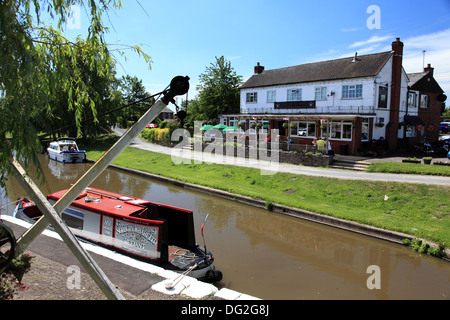 Narrowboats at Norbury Junction on the Shropshire Union Canal, the Junction Inn in the background Stock Photo