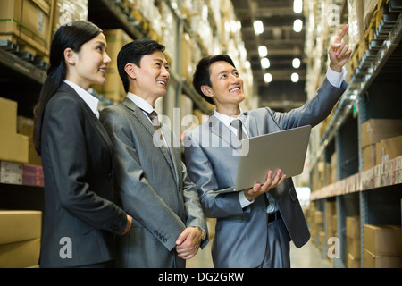 Business team in logistic warehouse Stock Photo
