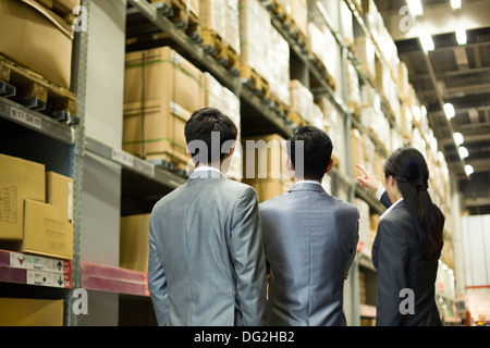 Business people talking in warehouse Stock Photo