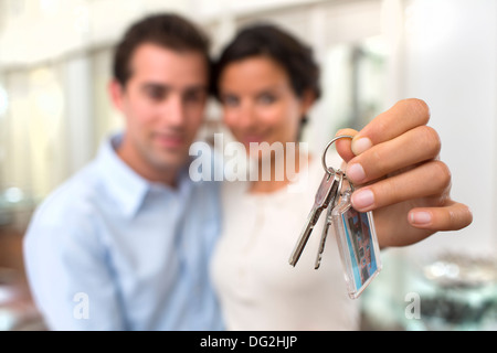 Woman man keys indoor room hand finger Stock Photo