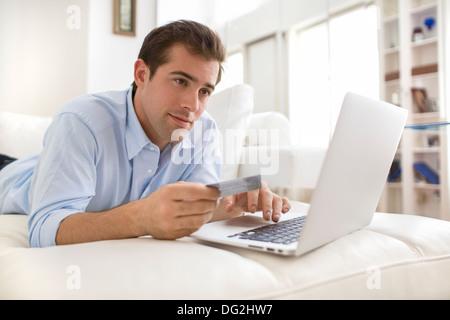 Male couch sofa indoor computer internet Stock Photo