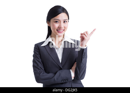 Cheerful businesswoman pointing Stock Photo