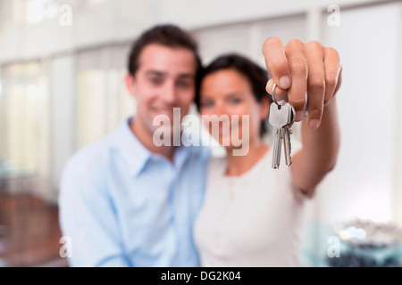 Woman man keys indoor room hand finger Stock Photo