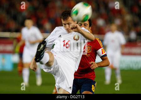Palma de Mallorca, Spain, 12th Oct 2013, Belarus Balanovich challenges the ball with Spain«s Xavi during their 2014 World Cup qualifying soccer match at Son Moix stadium in Palma de Mallorca on friday 11th October. Zixia/Alamy Live News. Stock Photo