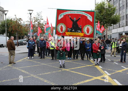 Dublin, Ireland. 12th October 2013. Members of SIPTU (Services Industrial Professional Technical Union) are being led by two bagpipers and a huge Union banner. Unions called for a protest march through Dublin, ahead of the announcing of the 2014 budget next week. They protested against cuts in Social Welfare, Health and Education and for an utilisation of alternative revenue sources by the government. © Michael Debets/Alamy Live News Stock Photo