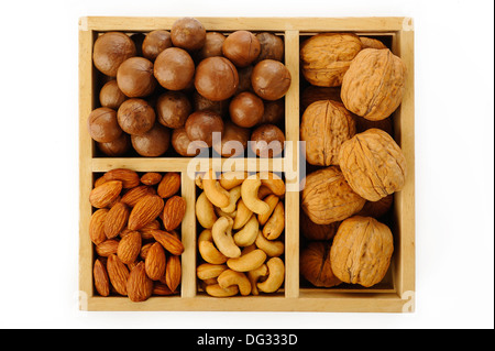 Assorted nuts in wooden box Stock Photo
