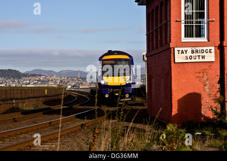 Scotrail commuter train crossing the Tay railway bridge from Dundee approaching the signal box in Wormit Fife, UK Stock Photo
