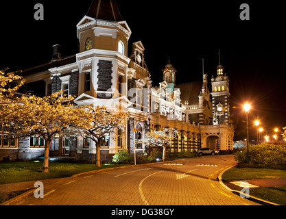 Dunedin, Otago, South Island, New Zealand. A night view of the famous railway station designed by Sir George Troup. Stock Photo