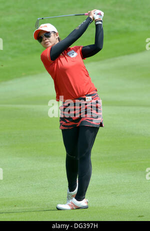 Kuala Lumpur, Malaysia. 13th Oct, 2013. Pornanong Phatlum of Thailand plays her second shot on 18th hole during the final round LPGA Sime Darby from the Kuala Lumpur Golf and Country Club. Credit:  Action Plus Sports/Alamy Live News Stock Photo