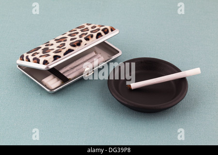 Roll ups and a retro style cigarette case Stock Photo