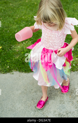 Young Girl Wearing Fairy Dress and Holding Cup, High Angle View Stock Photo