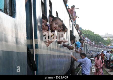 Thousands of Bangladeshis cram onto trains at the Airport Railway Terminal on the outskirts of Dhaka on 13 October 2013,  ahead of Eid-al Adha. Stock Photo