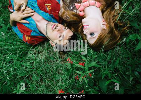 Couple Laying on Grass Field, Close Up, High  Angle View Stock Photo