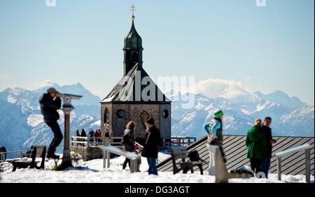 Tegernsee, Germany. 13th Oct, 2013. Strollers enjoy the sunshine at the ...