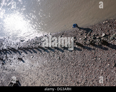 Mudlark, person searching for artifacts washed up on the banks of the River Thames in central London Stock Photo