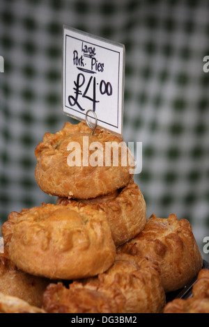 Pork pies for sale on stall Stock Photo